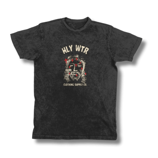 Distressed black HLY WTR t-shirt featuring a central vintage-style graphic of Jesus with red cross accents, epitomizing urban Christian streetwear.